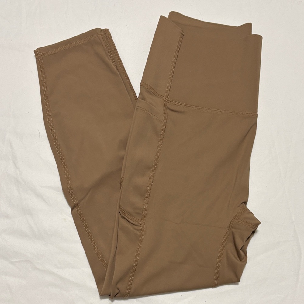 She curve tummy control, butt lifting nude/tan leggings. New, never wore.
